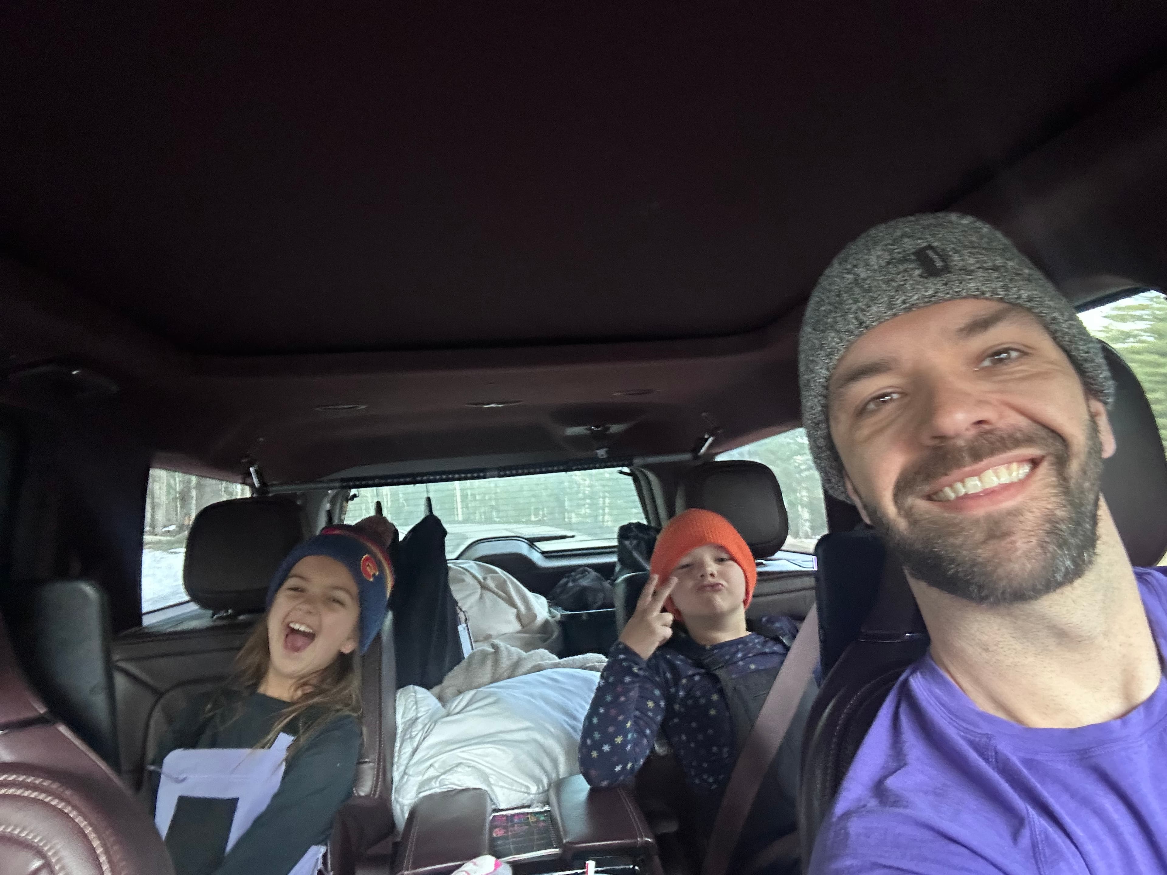 Family road trip selfie heading to the mountains